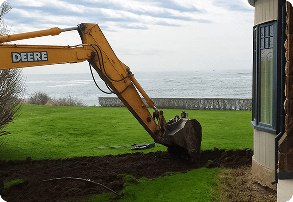 Machinery working on grassy lawn